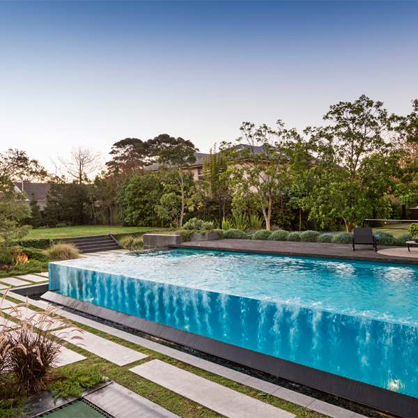Infinity Transparent lap pool with spa by Liquid Blue Pools