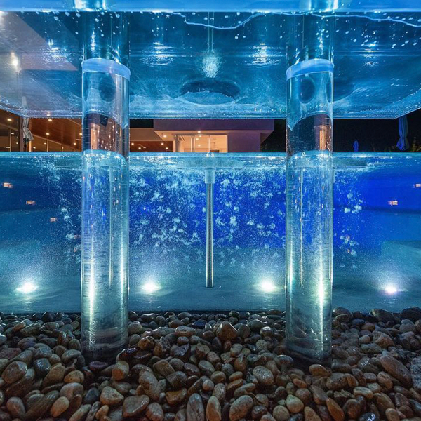 above ground transparent pool by Melos Pools and Outdoors