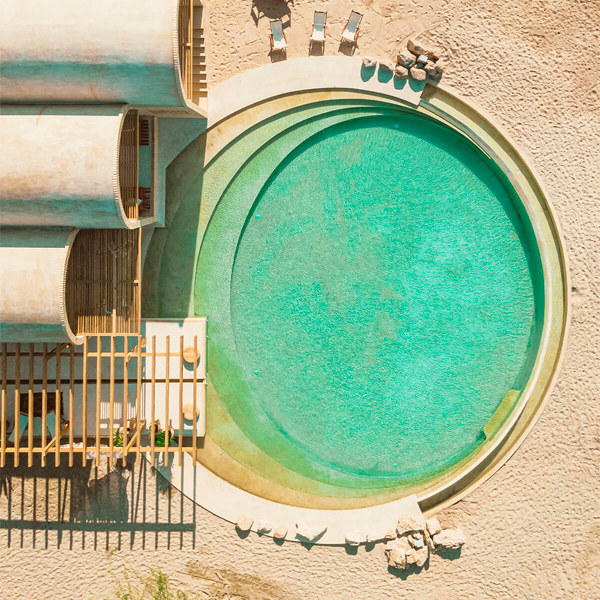 round overflow pool in Casona Sforza drone view by TAX Architects
