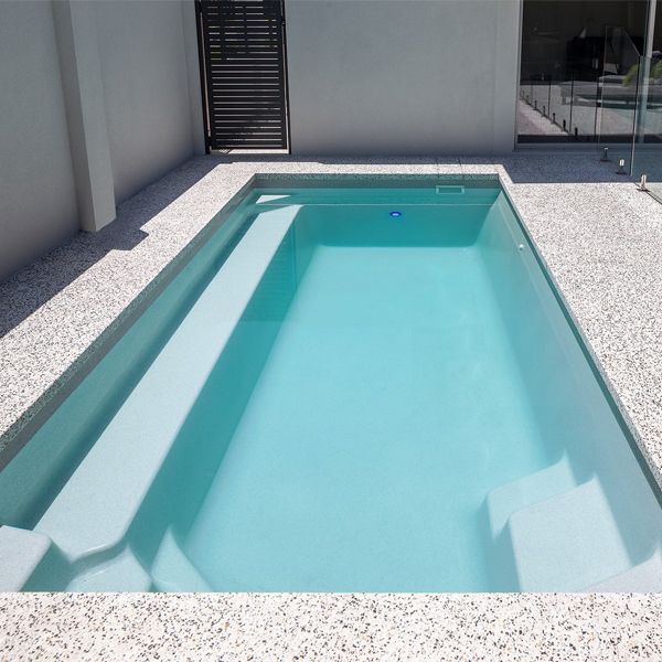 prefab mini pool with an alabaster colour ina private backyard, by Freedom Pools Australia