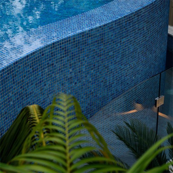 Glass mosaic tile in a custom infinity pool, by Fluid Design