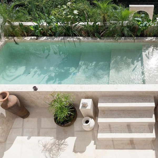 above ground white pool by Terreo Studio
