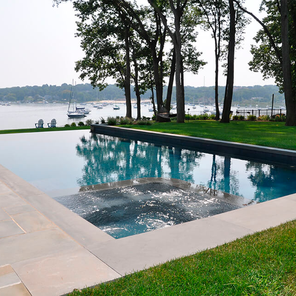 swimming pool close to a lake
