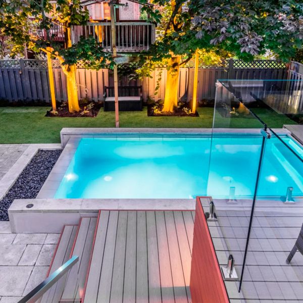mini infinity pool in a modern design backyard at night, by Landcon