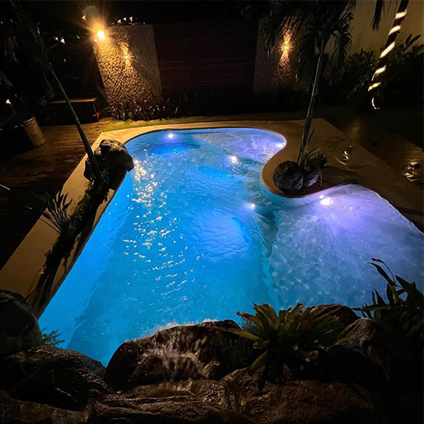 sand pool at night by Piscina Praia Brazil