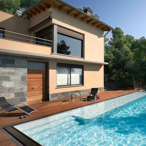overflow pool surrounded by wood decking