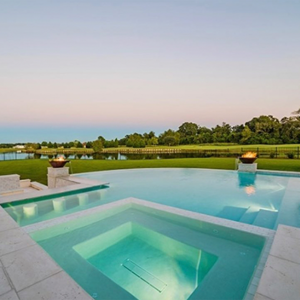 custom infinity pool with spa by GW Oliver