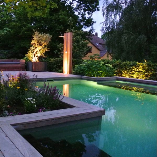 custom natural pool at sunset, by Messner Gaerten