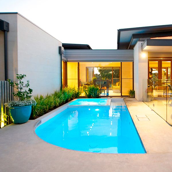 white custom pool with spa, by Icon Pools