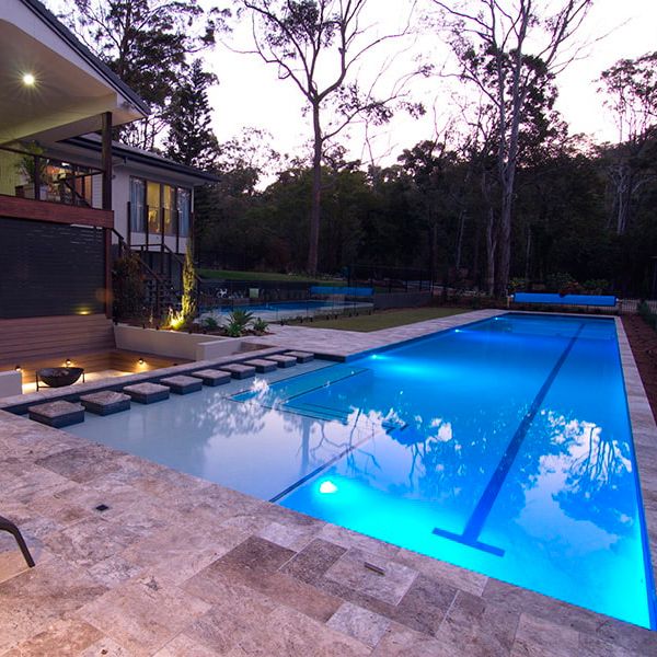 custom lap pool at sunset, by Cityscapes Pools and Landscapes