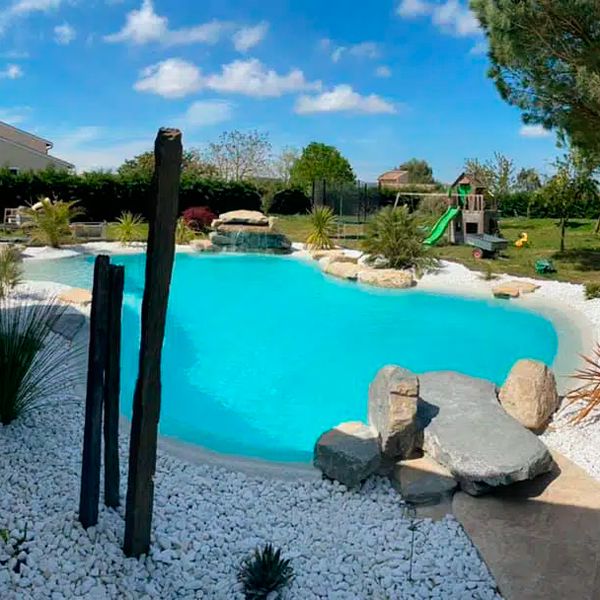 Custom lagoon pool in a private garden, by Piscines HDP