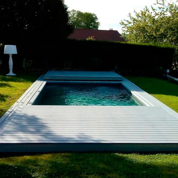 prefab mini pool by Essonne Piscine et Spa, with a mobile terrace