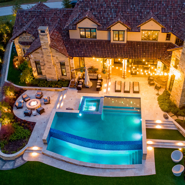 infinity pool with spa drone view by Farley Pool Designs