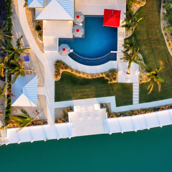 drone view of a custom infinity pool with spa by D´Asign Source