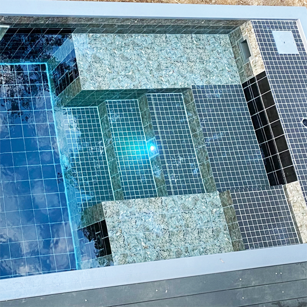 mini pool with an underwater window by Via Pools