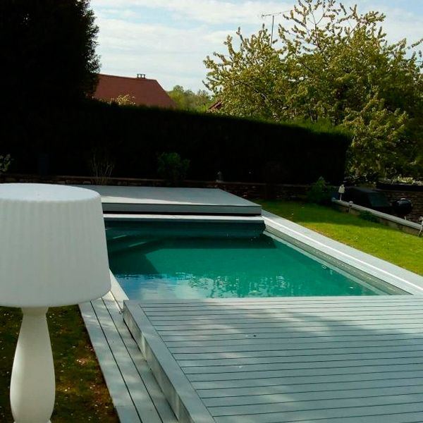 prefab mini pool by Essonne Piscine et Spa, with a mobile terrace