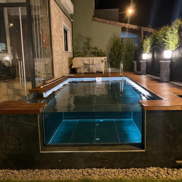 minipool with a transparent wall at night