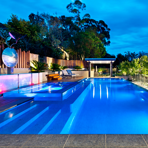 lap infinity pool and spa at night by Justine Carlile