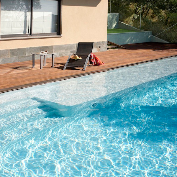 infinity pool surrounded by wood decking