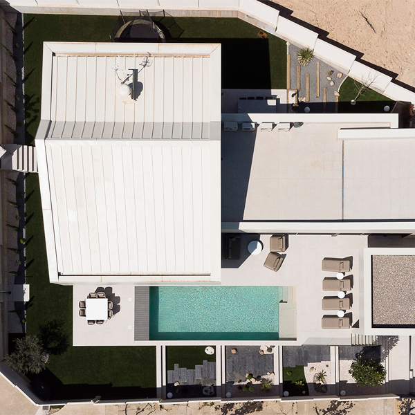 drone view of a minimalist pool in a project by BR29