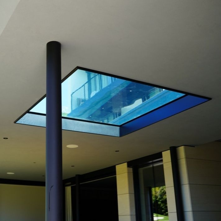 Squared shaped underwater window by Holland Aqua Sight, at the bottom of a pool, seen from below