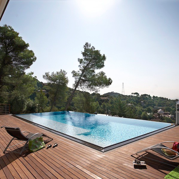 infinity pool surrounded by wood decking