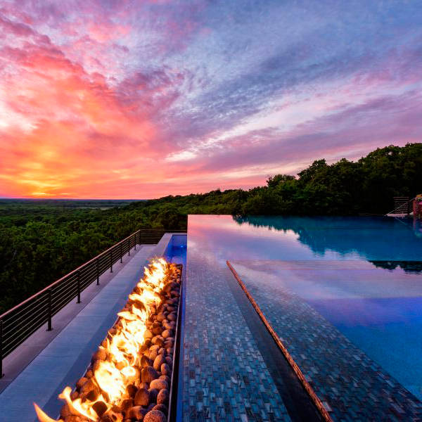view from an infinity pool at sunset