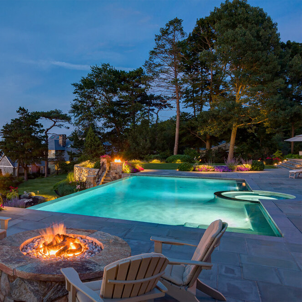 lighted infinity pool and spa by Custom Quality Pools