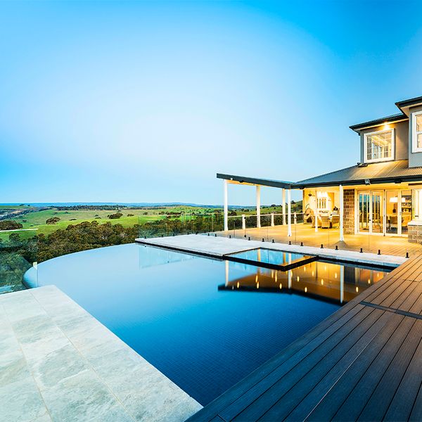 Custom infinity pool with built-in spa, by Esjay Landscapes