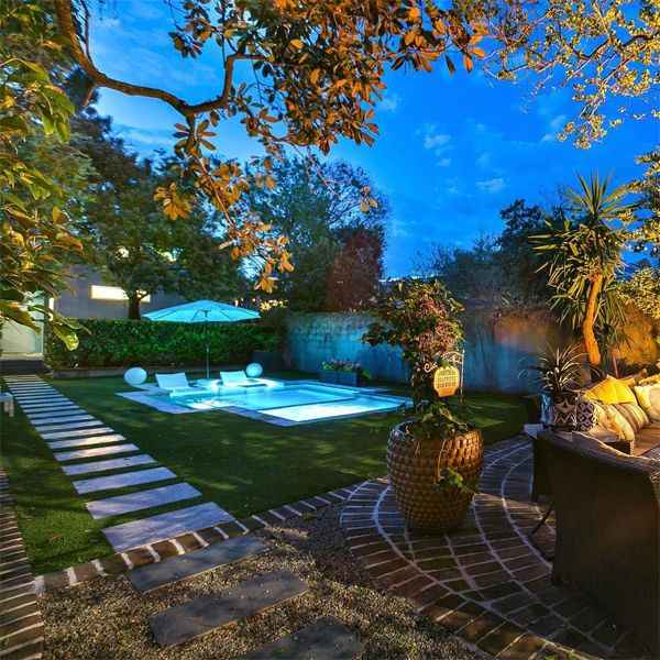 private pool and spa at night by Heritage Pools