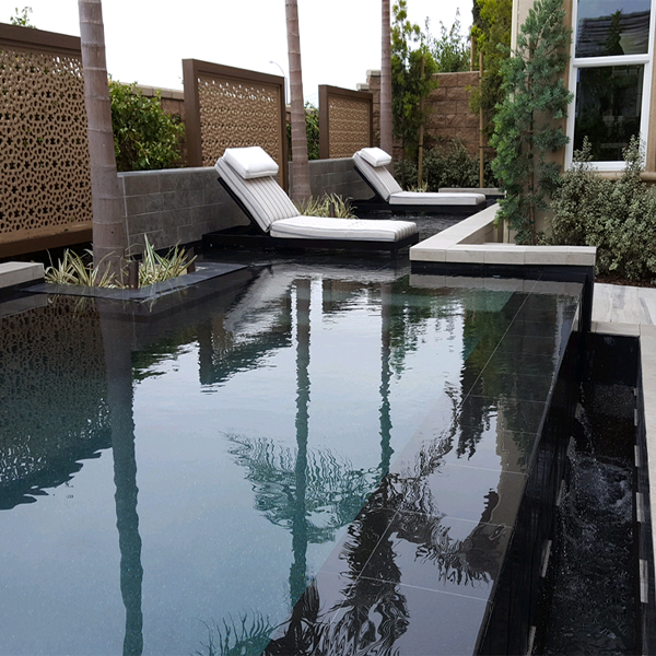dark colored infinity mini pool by Pinnacle Pools and Spas