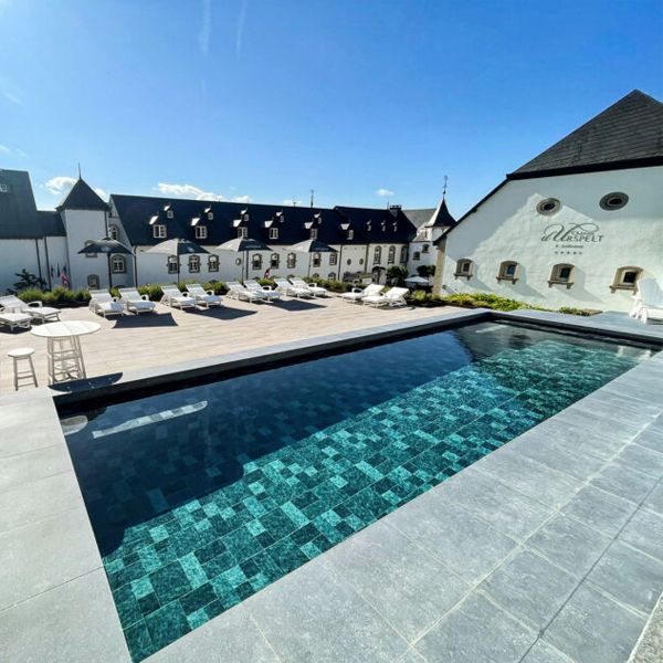 Geometric hotel pool with porcelain stoneware coating, By Piscines Ondine