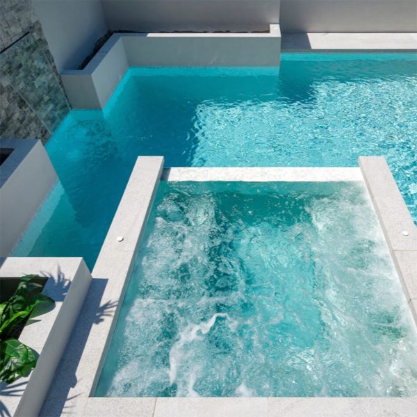 overflow spa over a custom-designed mini pool with straight lines, by Queensland Family Pools and Spas