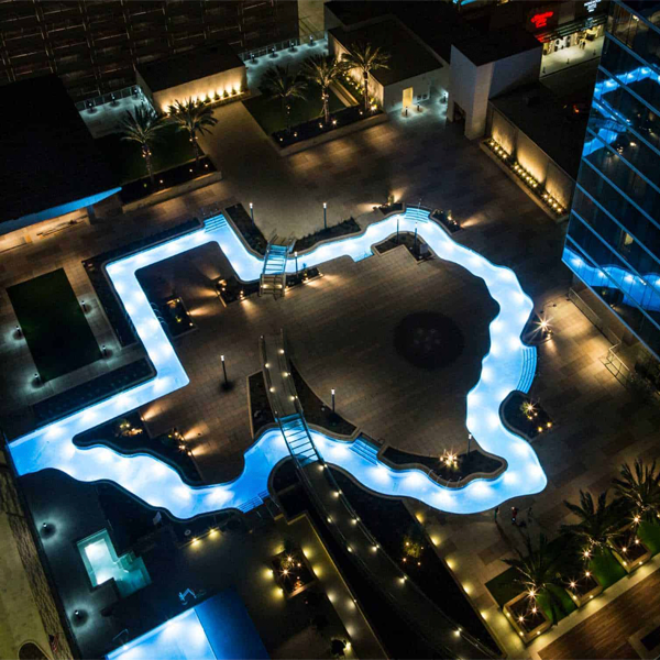 pool with the shape of the state of texas at night