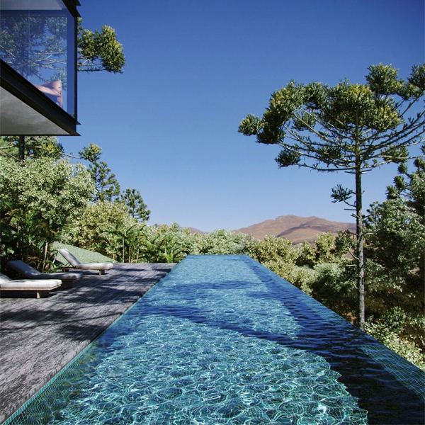 infinity pool in the woods by Tripper Arquitetura