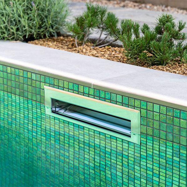 inox steel skimmer in a bright tile private pool by Aquaria Pools