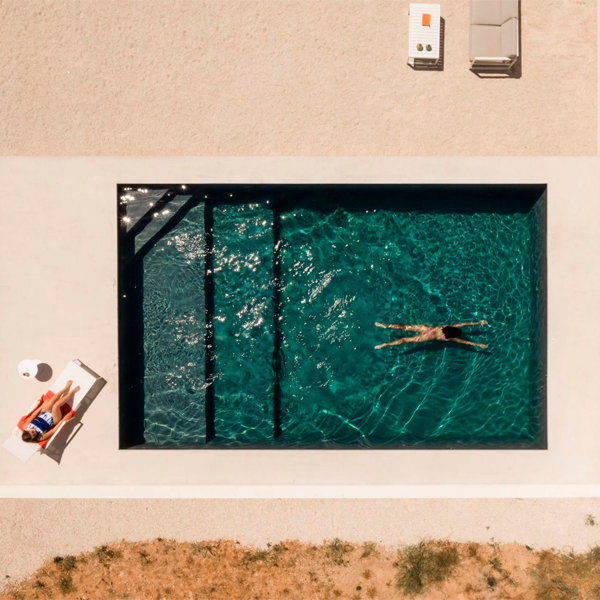 dark mini pool drone view by DC AD