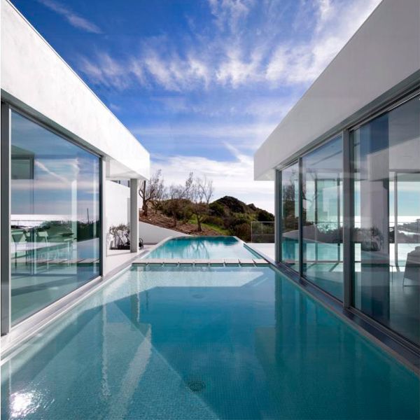 white infinity lap pool in a project by Mario Martins Atelier