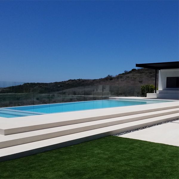 white infinity pool with built-in spa, by Monaco Luxury Pools