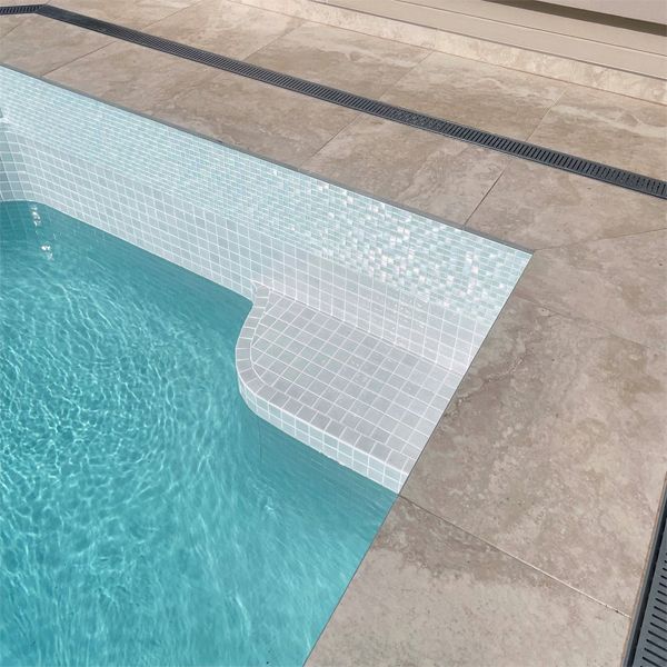 interior of a pool with glossy white glass tile coating, by Adelaide Classic Pools