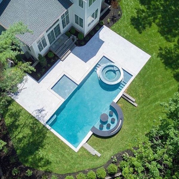 drone view of a private pool with spa by Sj Pools and Landscaping