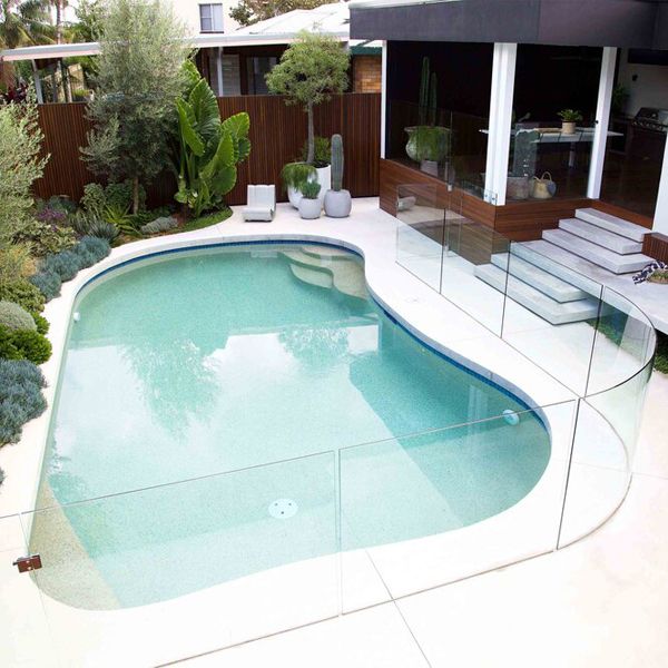 drone view of a custom family pool, curved shaped, by Impressions Pools