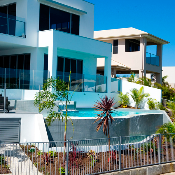 custom infinity pool with raised spa by Brisbane Pools and Landscapes