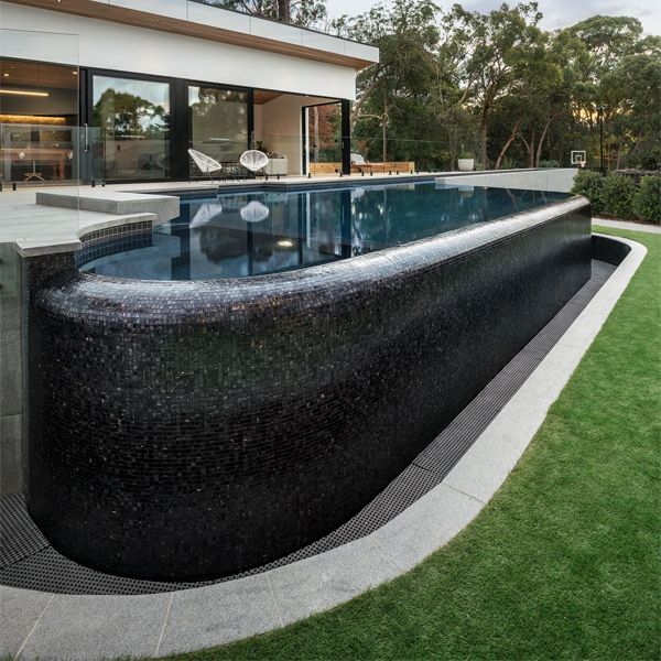 a unique infinity lap pool with spa by Laguna Pools