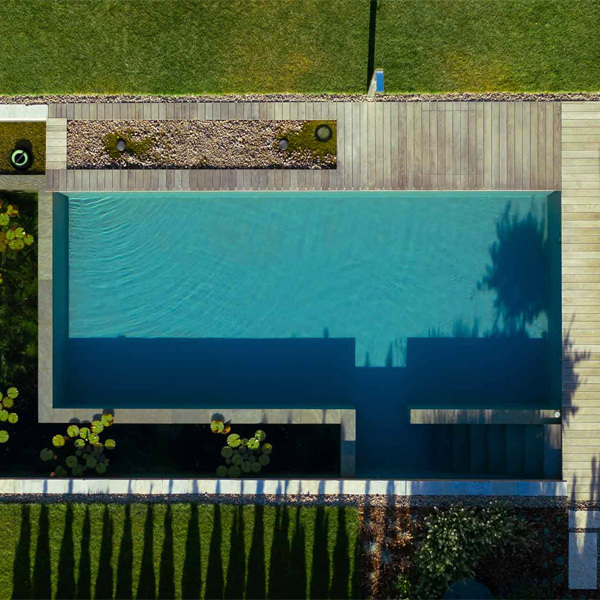 natural pool drone view, by Kalhofer