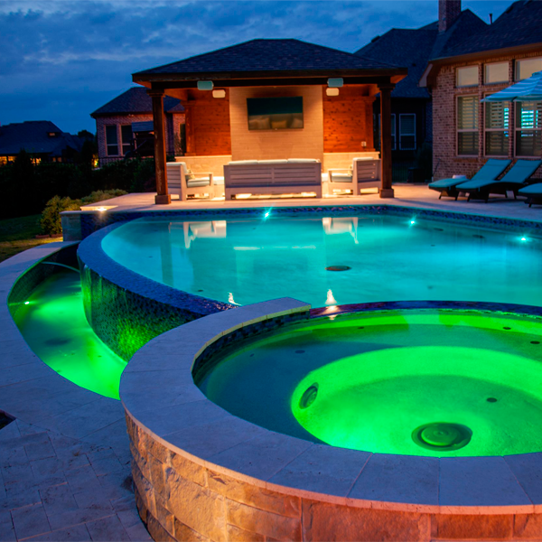 custom infinity pool with spa by Hauk Custom Pools