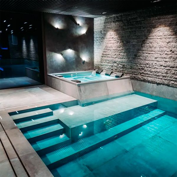 indoor overflow pool with spa, by Mari