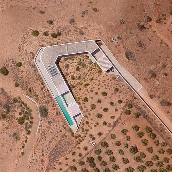 drone view of infinity pool on cliff