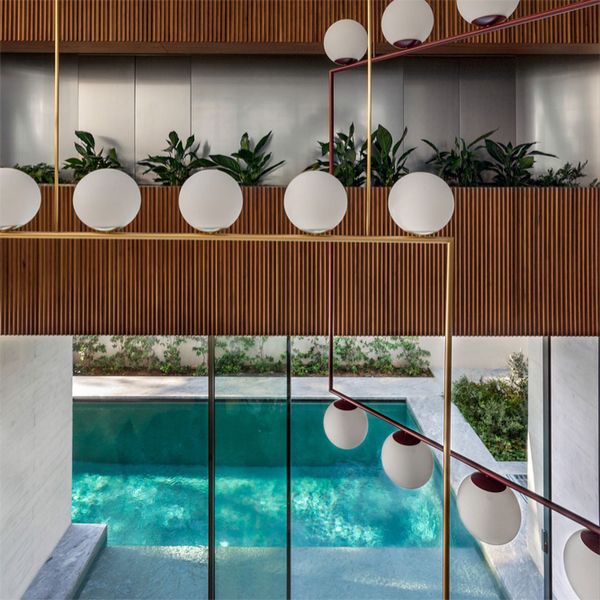 minimalist modern pool view from the sitting room of the house, in a project by Divercity Architects