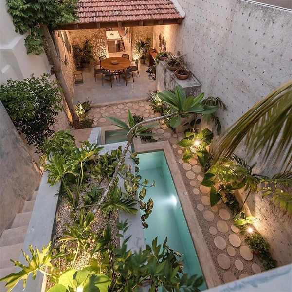 mini pool and landscape design at night, in a project by Workshop Arquitectos